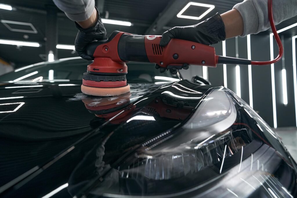 AutoShine technician buffing and polishing the exterior of a vehicle during a mobile detailing service in Chicago