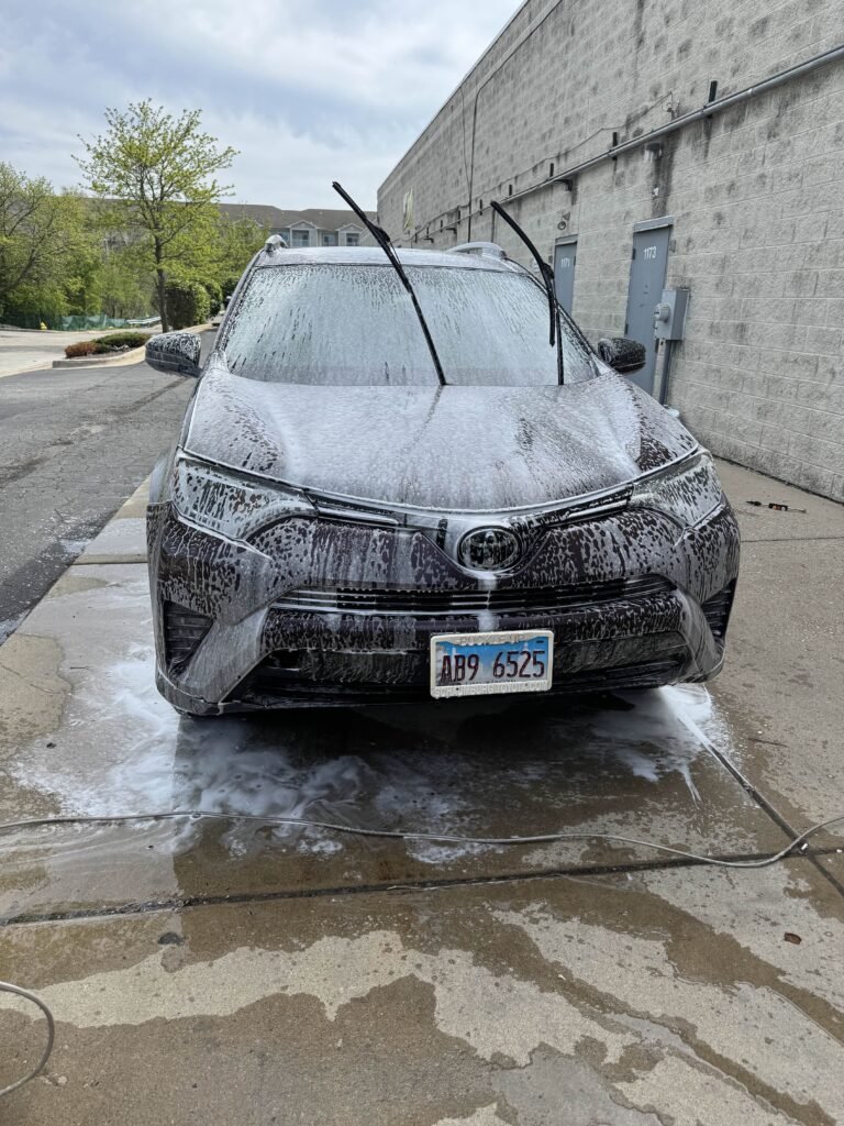 Toyota SUV being hand washed during mobile car detailing in Chicago by AutoShine